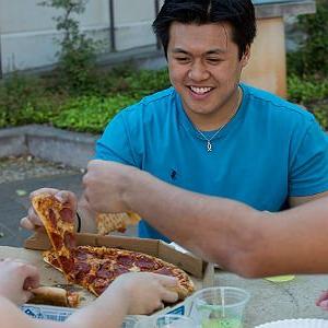 Scholarship awarded student enjoys pizza with fellow students